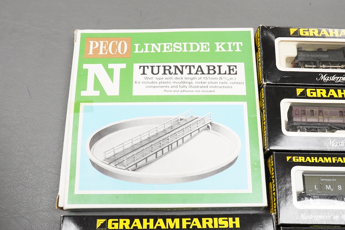 Thirteen N gauge railway by Graham Farish, etc., including two locomotives; a BR Class 4 0-6-0 tender locomotive, 4232, and an LMS 0-6-0T locomotive, 16389, together with two bogie coaches, eight freight wagons, and a Pe
